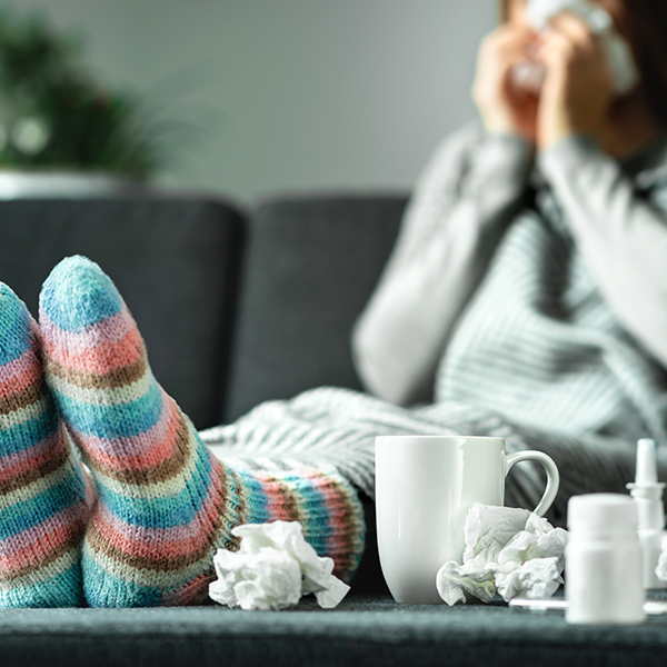 a woman blowing her nose